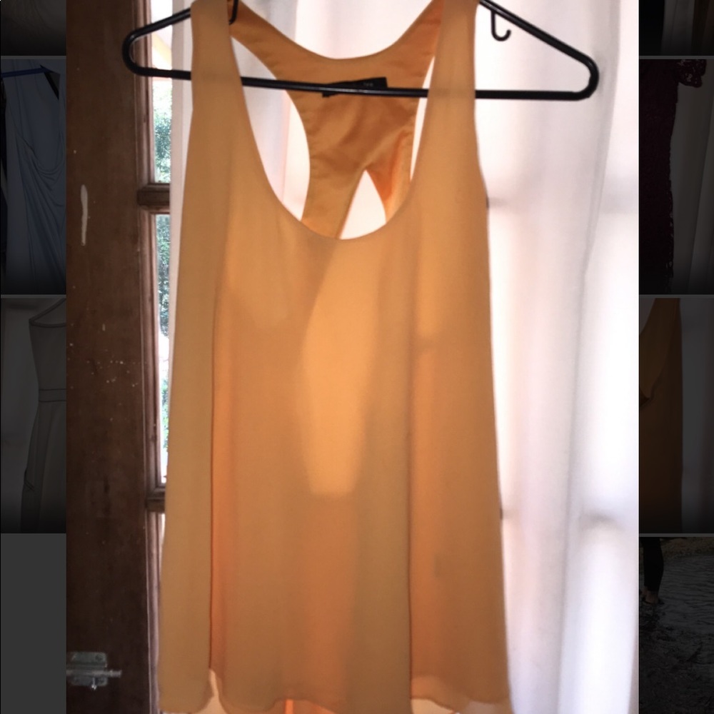 yellow tank top with open back . size M